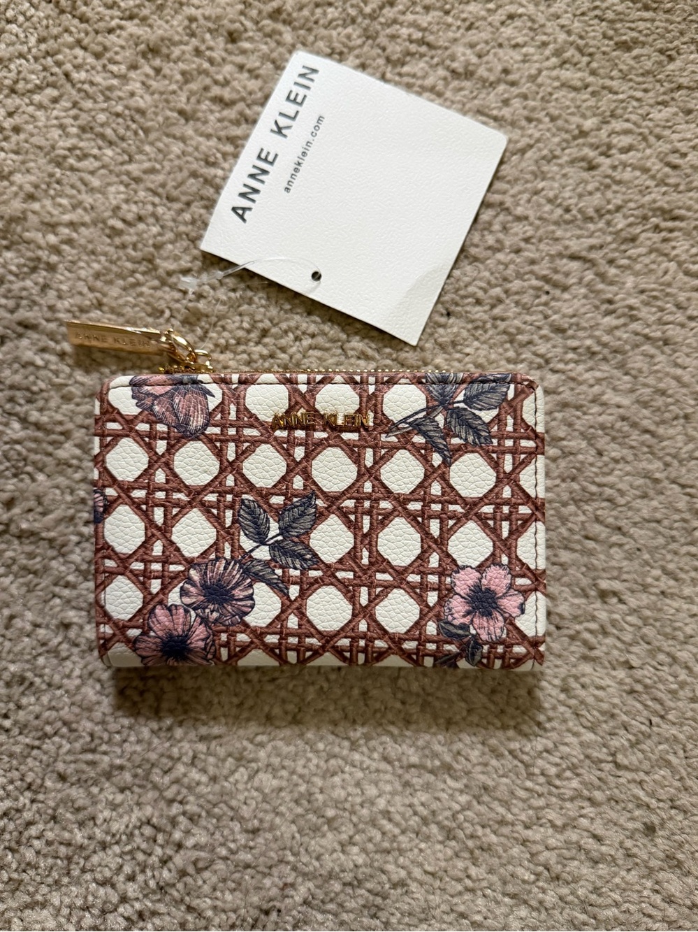 Anne Klein compact wallet featuring brown white lattice pattern with pink floral